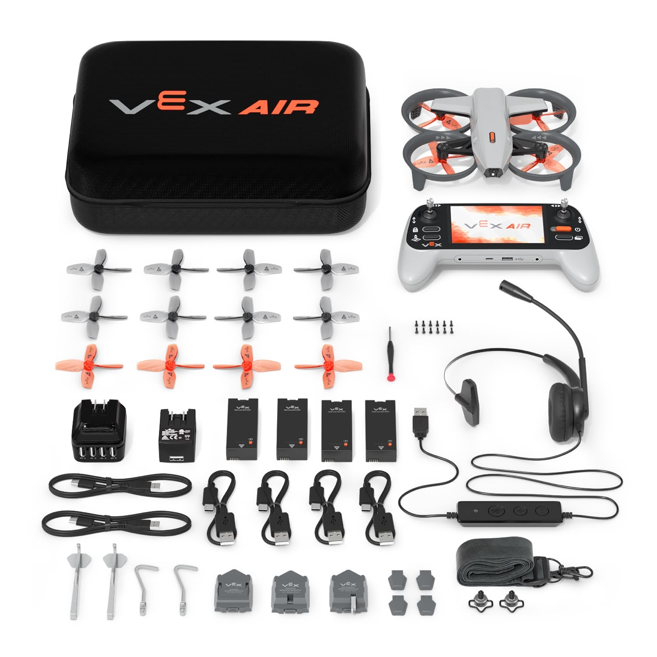 All of the components in the VEX AIR Kit laid out on a table beside the kit case.