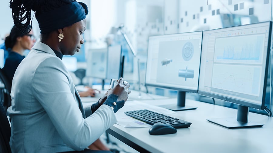 Industrial designer in a real world work setting sketching product concepts with digital tools to illustrate creativity and engineering skills.