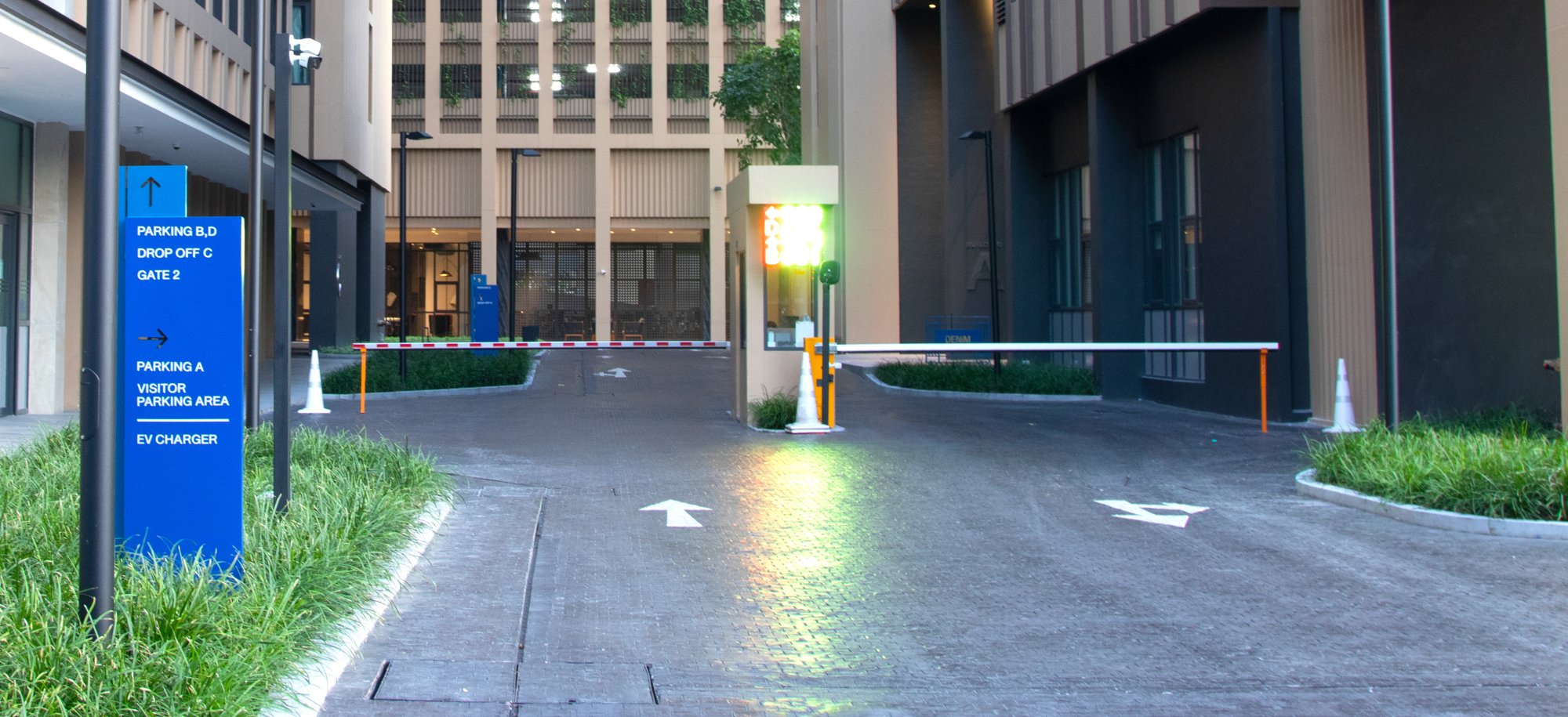 Parking gates at a building entrance.