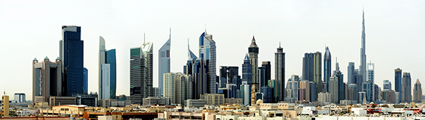 An Image Showing the Skyline of Dubai Featuring Many Skyscrapers