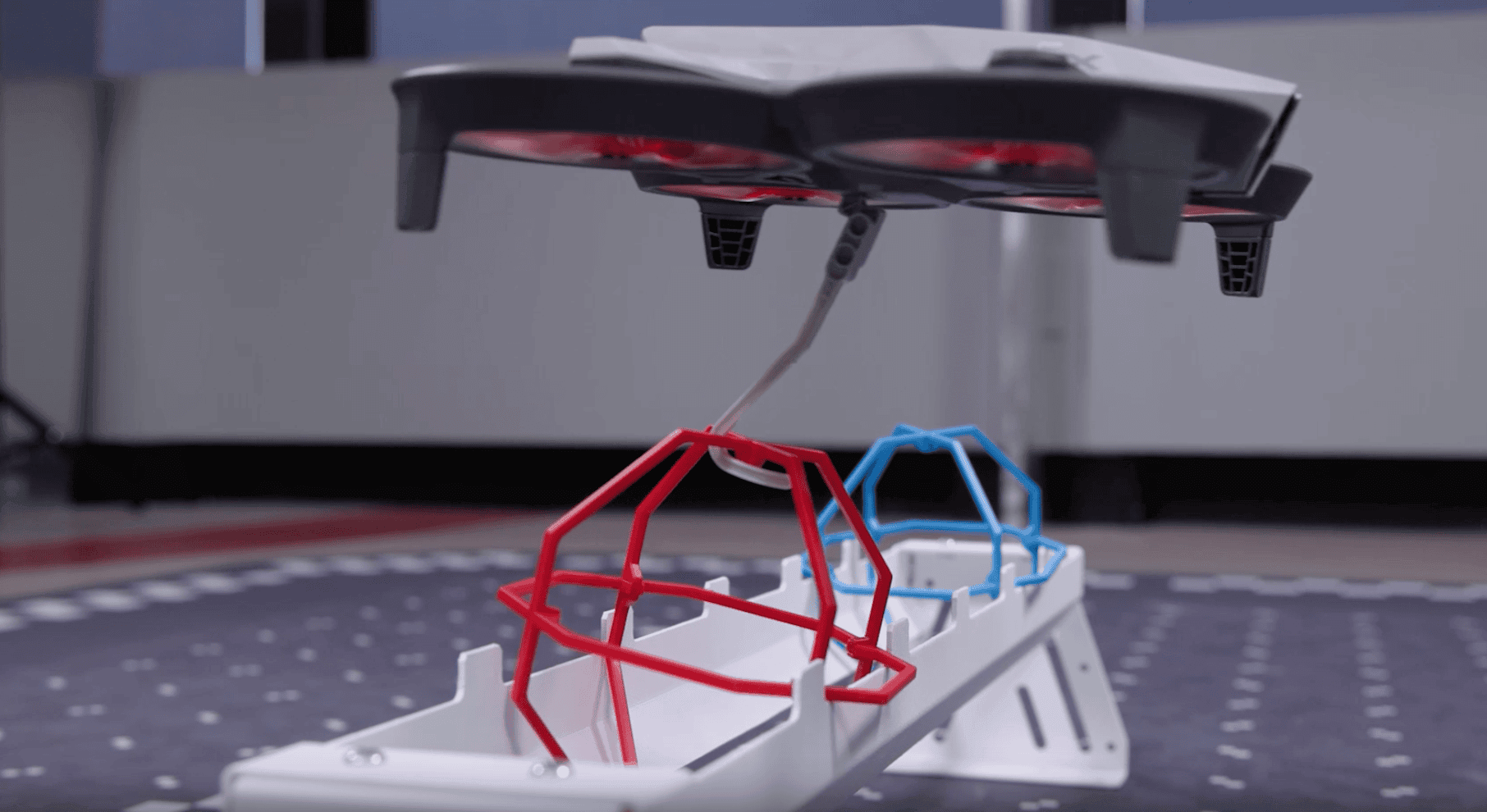 VEX AIR Drone mid flight with the motorized hook down catching an orbit ball.