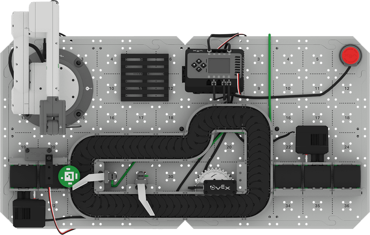 Top down view of the CTE Workcell Base build with a green disk moved to the start of the Exit Conveyor.