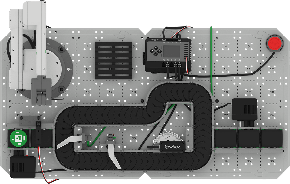 Top down view of the CTE Workcell Base build with a green disk at the end of the Exit Conveyor.