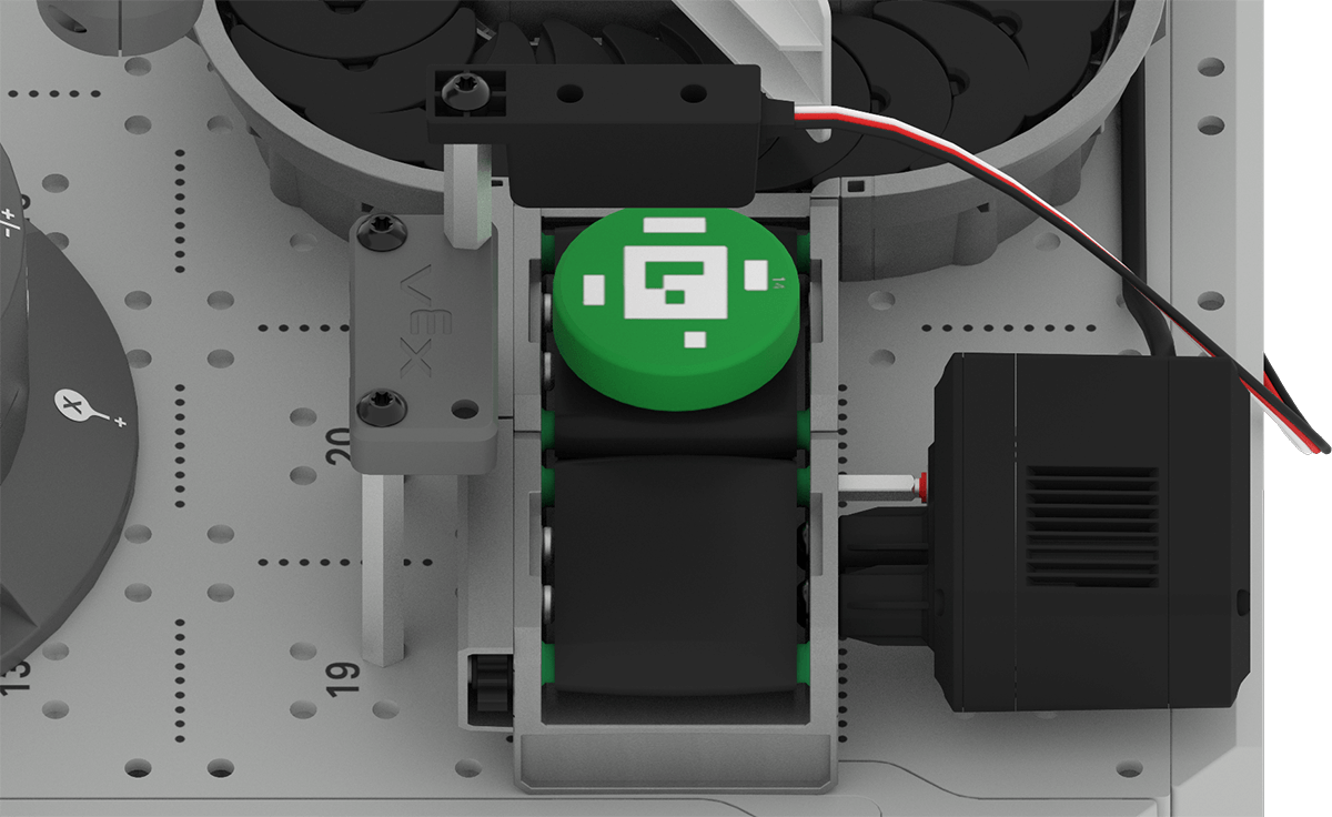 The green Disk positioned on the Exit Conveyor under the Object Sensor.