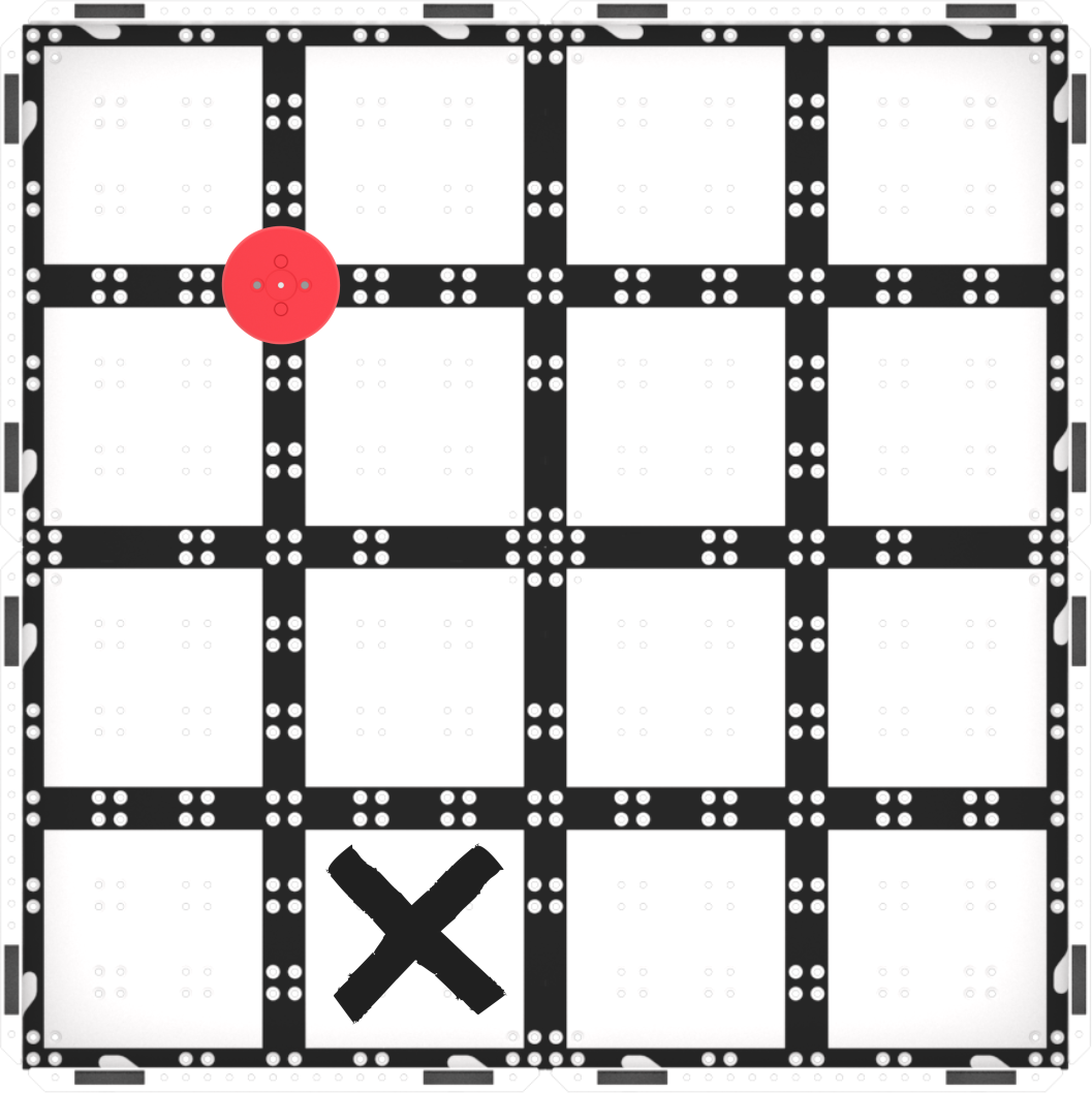 A top-down view of a GO field with a red disk in the top left and a black 'X' drawn with dry erase marker on the bottom of the field to the left.