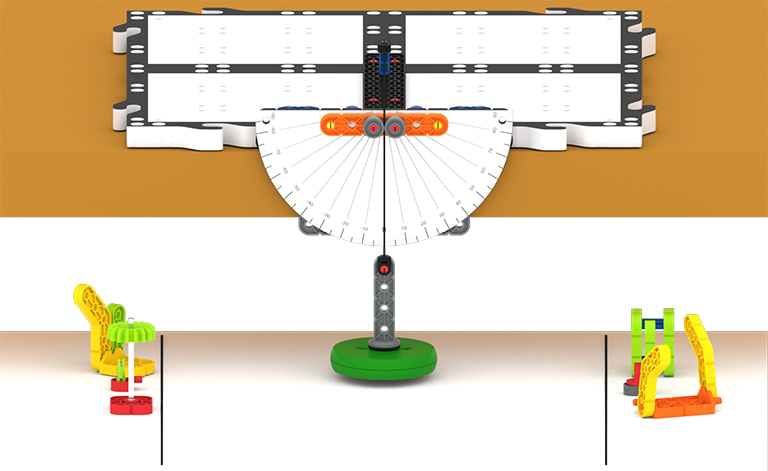 La struttura del pendolo è appoggiata su una superficie rialzata, con il peso del pendolo che pende dritto verso il basso al centro. Sotto il pendolo si trovano vari pezzi del gioco: tre pezzi sono all'estrema sinistra dietro una linea, e tre pezzi sono all'estrema destra dietro una linea.  