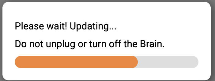 The firmware update progress bar shows partial progress. The text reads Please wait! Updating... Do not unplug or turn off the Brain.