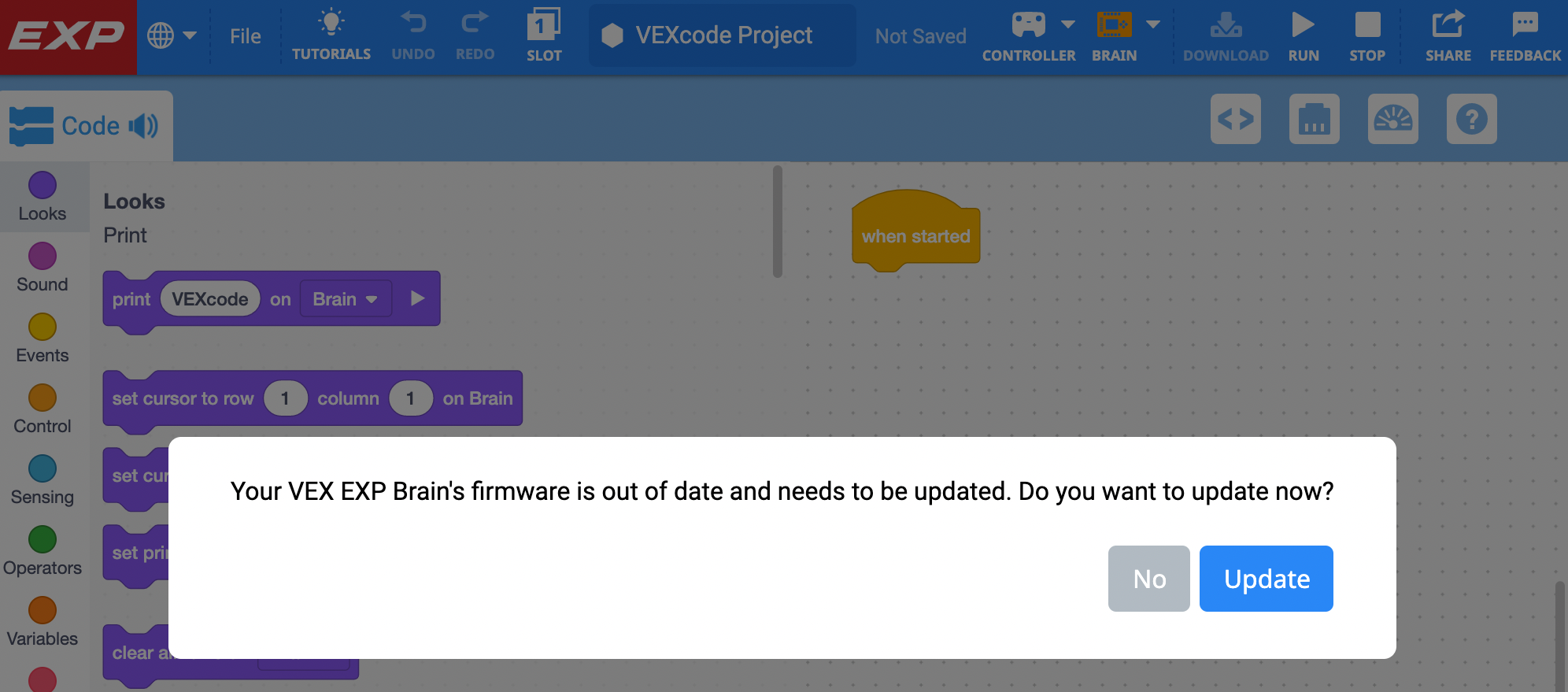 VEXcode EXP interface with a pop up dialog that reads Your VEX EXP Brain's firmware is out of date and needs to be updated. Do you want to update now? With two button options in the lower right corner. To the left a gray button reads No, to the right a blue button reads Update.