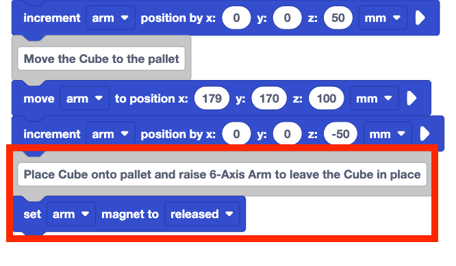 The same stack of blocks from before with two new blocks added to the bottom. These two new blocks are a comment block that reads Place Cube onto pallet and raise 6-Axis Arm to leave the Cube in place and a set arm magnet to released block. These two new blocks are highlighted with a red box.