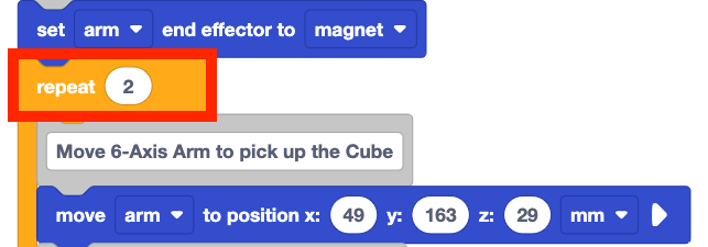 The same stack of blocks from before, but now everything below the set arm end effector to magnet block is inside a repeat block. The repeat block's parameter is set to two, indicating that it will repeat all the blocks within it twice. The repeat block is highlighted with a red box.