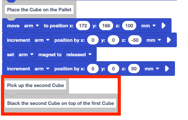 The same Blocks code project from before, showing the project below the comment block that reads Place the Cube on the pallet. Two new blocks are added to the bottom, a comment block that reads Pick up the Second Cube and a comment block that reads Stack the second Cube on top of the first Cube. These two new blocks are highlighted with a red box.