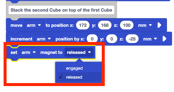 The same stack of blocks from before with a newly added set arm magnet to released block. This block is highlighted with a red box and shows the block's parameters open to indicate the selection of released instead of engaged.