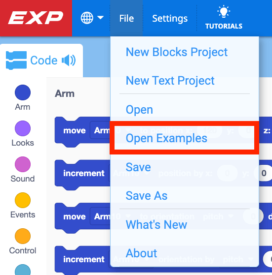 File Menu in VEXcode EXP open, with Open Examples highlighted. Open Examples is the fourth menu item after New Blocks Project, New Text Project, and Open.