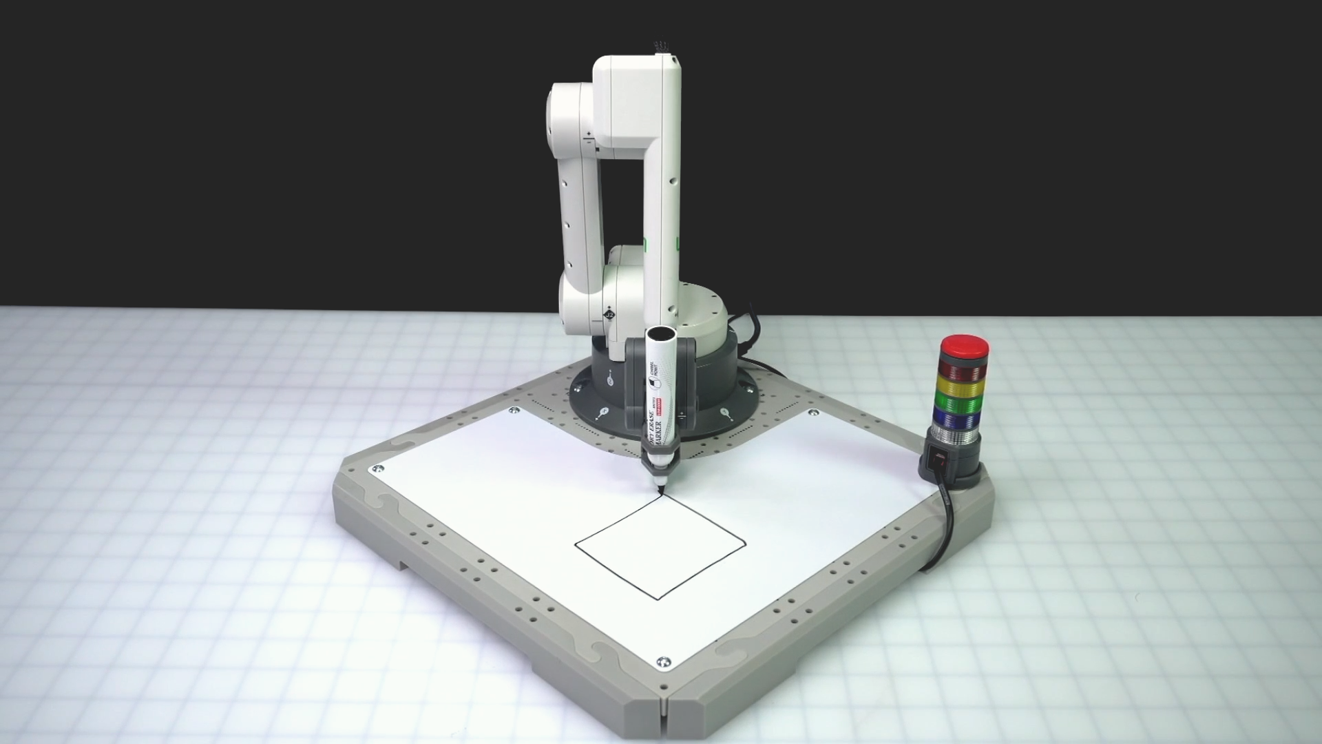 Angled view of the 6 Axis Arm with the square drawn as intended on the whiteboard surface.