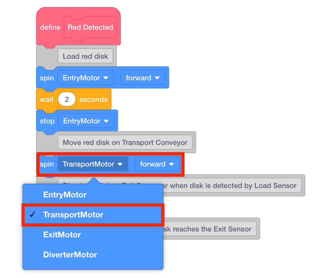 Add a [Spin] block to the ‘Move red disk on Transport Conveyor’ comment.