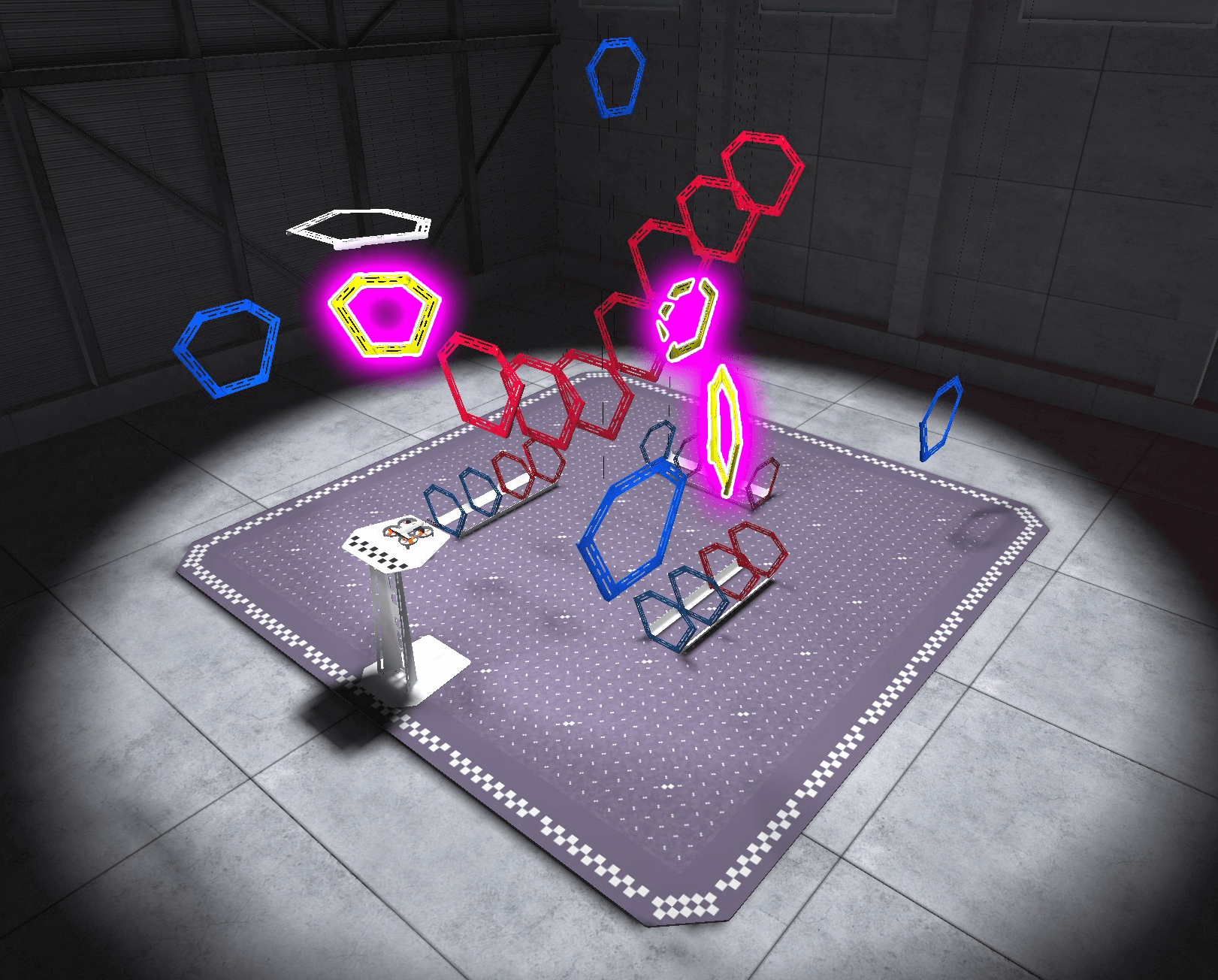 An aerial view of the Rings layout in the VEX AIR Flight Simulator, with the three yellow rings highlighted, making a diamond shape with the fourth corner as the platform.