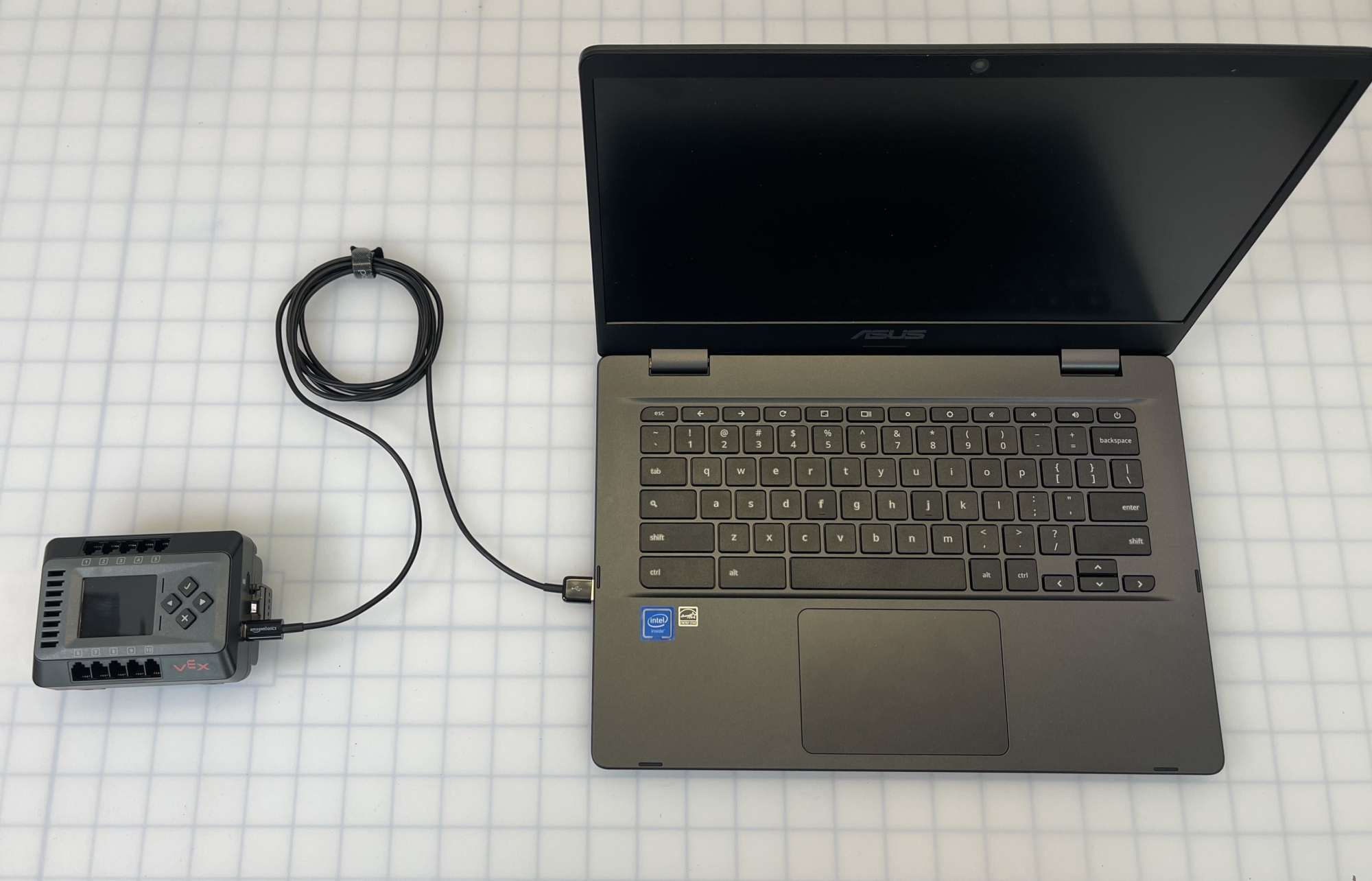 Photo of the EXP Brain connected to a laptop via a USB cable.