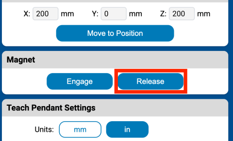 Magnet section of the Teach Pendant with the Release button called out with a red box.