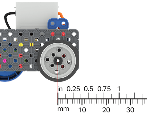 A ruler is overlayed on a Code Base robot to show the distance that it has driven.